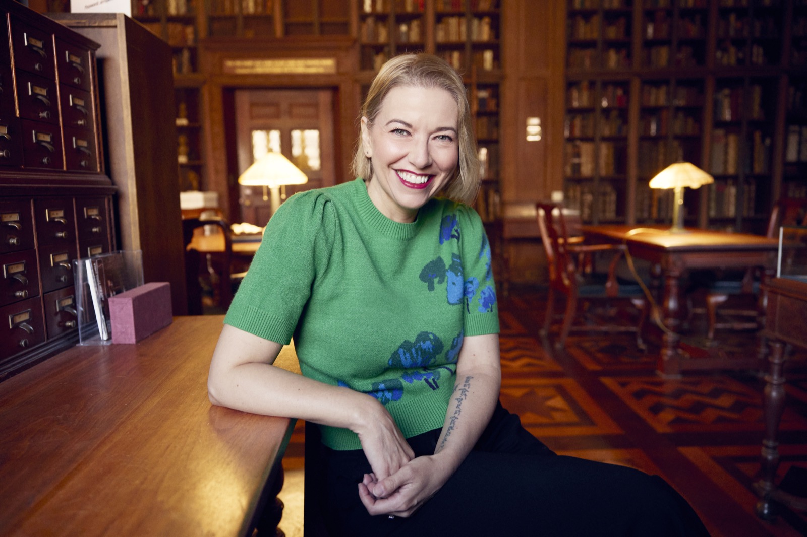 Theresa MacPhail in the library, by Jesse Dittmar
